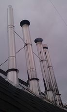 Нержавіюча манжетка для герметизації димоходу в покрівлі